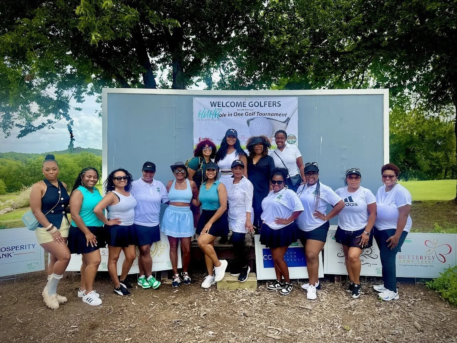 A group of golfers at the Welcome Golfers board, 2026 HUHH Golf Classic