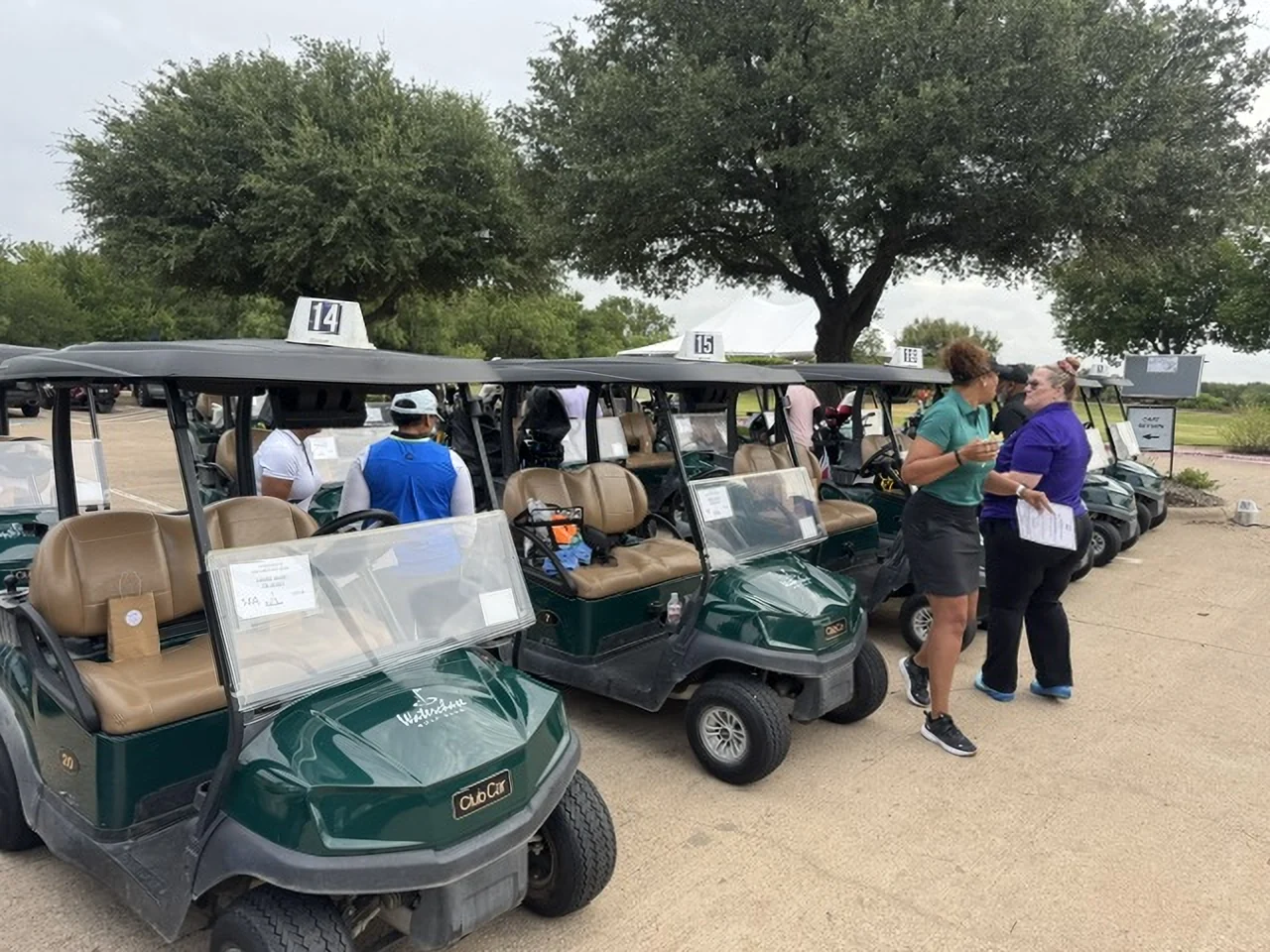 Golf carts lined up for check-in at the 2026 HUHH Golf Classic