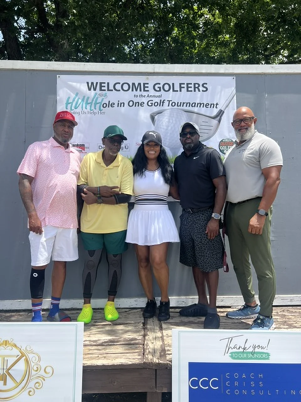 A foursome at the Welcome Golfers board